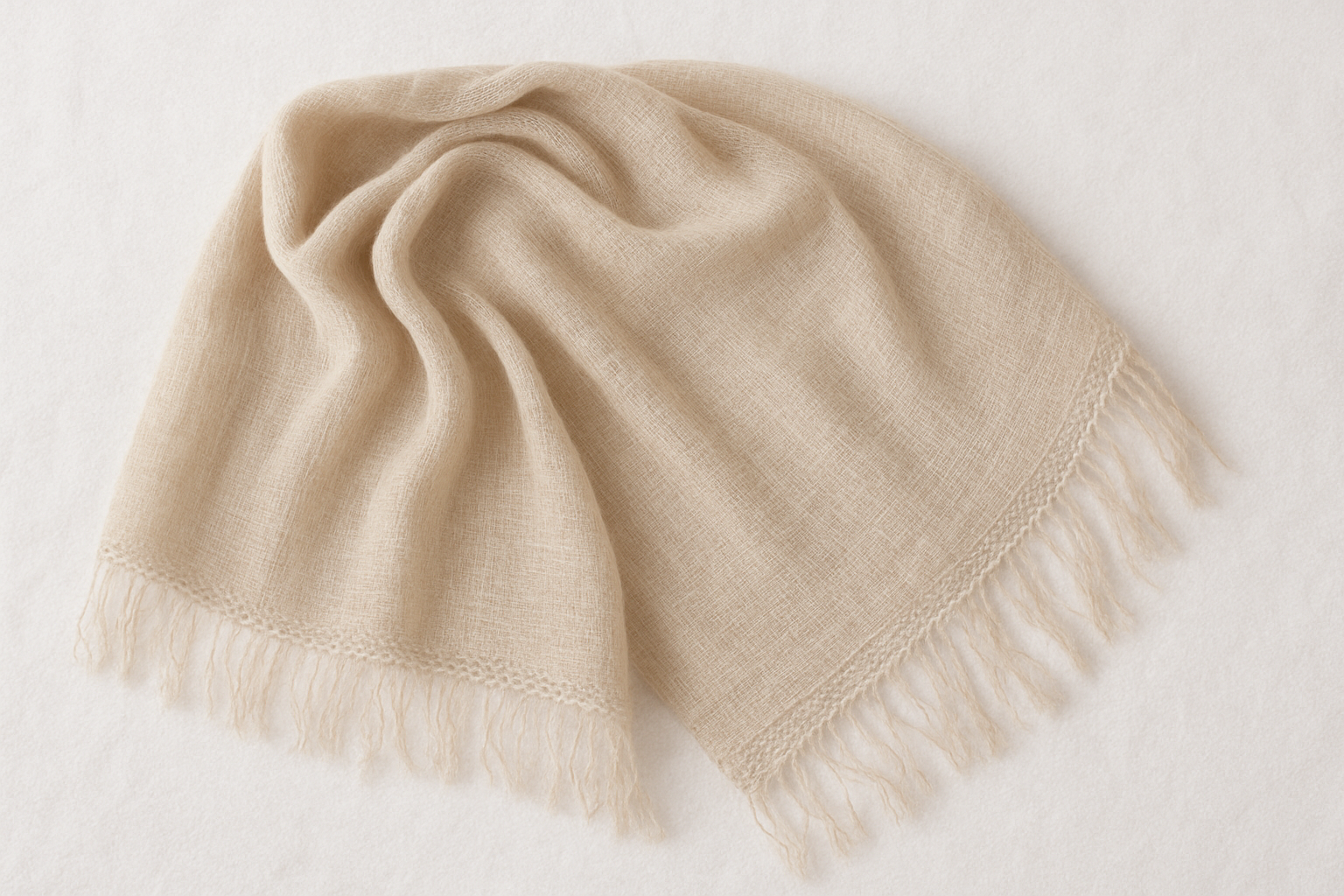 shawl laid flat on a towel